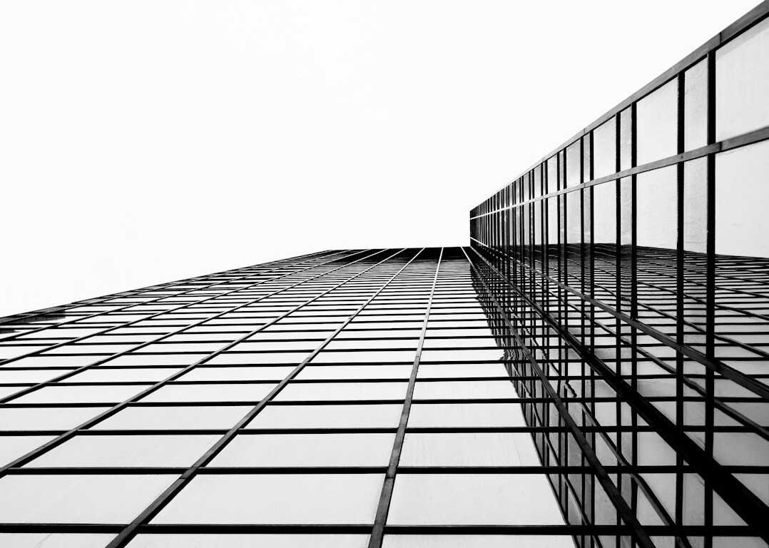 Modern glass office building seen from below