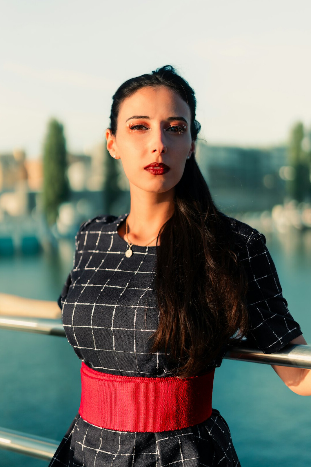 Professional woman with dark hair looking at the camera
